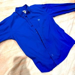 Cinch long sleeve button down collared shirt.  Royal blue. Size youth 12